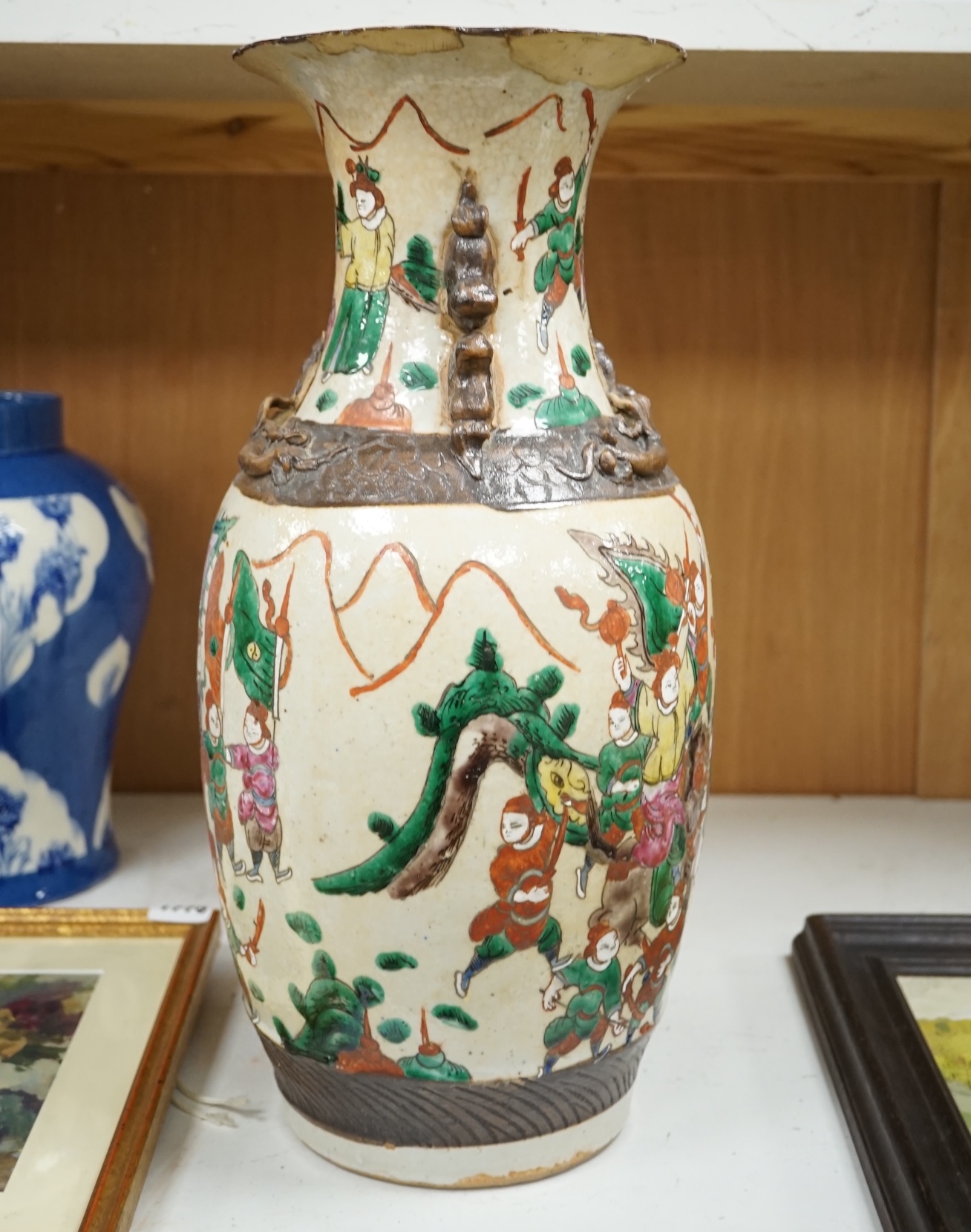 A Chinese crackleglaze famille rose 'Warriors' vase, early 20th century, 44cm high. Condition - poor